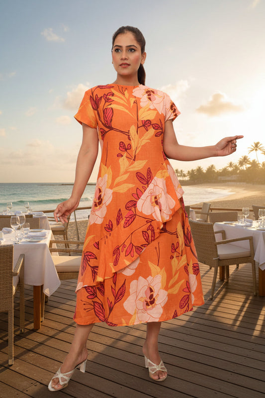 Woman wearing an orange floral dress against a plain background